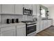 Modern kitchen with stainless steel appliances and grey cabinets at 1867 Vista Ridge Dr, Greenwood, IN 46143