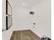 Laundry room with wood-look flooring and shelving at 1867 Vista Ridge Dr, Greenwood, IN 46143