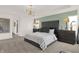 Main bedroom with plush bed, large window, and neutral color palette at 1867 Vista Ridge Dr, Greenwood, IN 46143