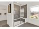 Large walk-in shower with gray tile and built-in seat at 1867 Vista Ridge Dr, Greenwood, IN 46143