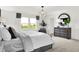 Primary bedroom with large windows and a modern chandelier at 19728 Patcham Rd, Westfield, IN 46074