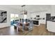 Eat-in kitchen with white cabinets and a multi-colored wood dining table and chairs at 19728 Patcham Rd, Westfield, IN 46074