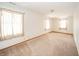 Spacious bedroom with neutral carpeting and ample natural light at 221 S State St, Markleville, IN 46056