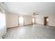 Spacious living room featuring laminate wood flooring and neutral walls at 221 S State St, Markleville, IN 46056