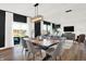 Bright dining area with a wood table, gray chairs, and view of living room at 2783 Linwood Ave, Greenwood, IN 46143