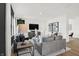 Bright living room with gray sofas, wood accent table, and modern decor at 2783 Linwood Ave, Greenwood, IN 46143