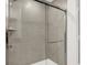 Clean shower with glass enclosure and neutral tile at 2783 Linwood Ave, Greenwood, IN 46143