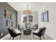 Sitting room with gray accent wall, four chairs, and a round table at 2783 Linwood Ave, Greenwood, IN 46143