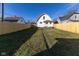 View of the home's exterior and fenced backyard at 401 N Chester Ave, Indianapolis, IN 46201