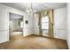 Spacious dining room featuring a chandelier and window at 4205 Cranbrook Dr, Indianapolis, IN 46250