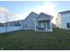 Gray house with backyard patio and seating area at 4411 Ringstead Way, Indianapolis, IN 46235