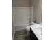 Clean bathroom with a tub, shower, and modern vanity at 4411 Ringstead Way, Indianapolis, IN 46235