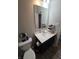 Bathroom with vanity, toilet and large mirror at 4411 Ringstead Way, Indianapolis, IN 46235