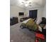 Main bedroom with a king bed, desk, and ceiling fan at 4411 Ringstead Way, Indianapolis, IN 46235