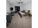 Main bedroom with a king bed, desk, and ceiling fan at 4411 Ringstead Way, Indianapolis, IN 46235
