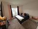 Cozy bedroom with plush carpet and large window at 4411 Ringstead Way, Indianapolis, IN 46235