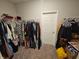 Large walk-in closet with hanging clothes at 4411 Ringstead Way, Indianapolis, IN 46235