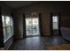Open dining area with sliding glass doors to backyard at 4411 Ringstead Way, Indianapolis, IN 46235