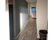 Bright hallway with hardwood floors and a rainbow effect from the window at 4411 Ringstead Way, Indianapolis, IN 46235