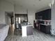 Modern kitchen with dark cabinetry and granite island at 4411 Ringstead Way, Indianapolis, IN 46235