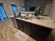 Kitchen island with double sink and granite countertop at 4411 Ringstead Way, Indianapolis, IN 46235