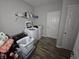 Laundry room with washer, dryer, and extra storage at 4411 Ringstead Way, Indianapolis, IN 46235