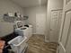 Laundry room with washer, dryer, and extra storage at 4411 Ringstead Way, Indianapolis, IN 46235