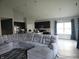 Open concept living room with sectional sofa and kitchen view at 4411 Ringstead Way, Indianapolis, IN 46235