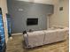 Living room with sectional sofa and accent wall at 4411 Ringstead Way, Indianapolis, IN 46235