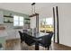 Bright dining area with backyard view and stylish black table and chairs at 4412 Chital Pl, Greenwood, IN 46143