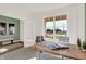 Home office with wood desk, large window, and green accent wall at 4412 Chital Pl, Greenwood, IN 46143