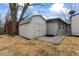 Backyard with storage shed, straw covered ground, and gravel pathway at 5410 Bertha St, Indianapolis, IN 46241