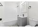 Updated bathroom with white subway tile, gray vanity, and modern fixtures at 5410 Bertha St, Indianapolis, IN 46241