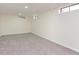 Spacious, carpeted basement room with multiple windows at 5615 Brouse Ave, Indianapolis, IN 46220