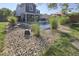 Inviting backyard oasis with in-ground pool, lush landscaping, and a relaxing lounge area at 5810 Spring Oaks Way, Indianapolis, IN 46237