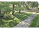 Backyard with a gravel path, mature trees, and a wooden fence at 5810 Spring Oaks Way, Indianapolis, IN 46237