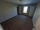 Empty bedroom with neutral walls and carpeted flooring at 6215 E 11Th St, Indianapolis, IN 46219