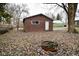 Brown detached garage with single door and window at 6736 Carlsen Ave, Indianapolis, IN 46214