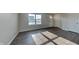 Living room with dark wood-look flooring and lots of natural light at 7056 E Mardenis N Dr, Camby, IN 46113