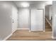 Home entryway with closet, staircase to the second floor, and wood-look flooring at 7609 Home Dr, Fishers, IN 46038