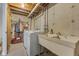 Basement laundry room with washer, dryer, and utility sink at 8008 Delbrook Dr, Indianapolis, IN 46260