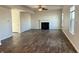 Cozy living room with a fireplace and large windows at 8428 Gates Corner Dr, Camby, IN 46113