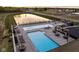 Aerial view of the community pool and surrounding area with lounge chairs and tables at 17368 Pinellas Ave, Westfield, IN 46074