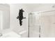Modern bathroom with a glass shower, white vanity, and black art at 1831 Vista Ridge Dr, Greenwood, IN 46143