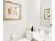 Clean bathroom with white subway tiles, modern vanity, and a framed piece of art at 1831 Vista Ridge Dr, Greenwood, IN 46143