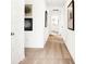 Long hallway with neutral walls and carpet, featuring framed art at 1831 Vista Ridge Dr, Greenwood, IN 46143