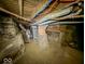 Unfinished basement with exposed brick, ductwork, and a water heater at 2218 N Arsenal Ave, Indianapolis, IN 46218