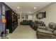 Finished basement with comfortable seating, a large TV, and sports memorabilia at 2386 Blackberry Ct, Greenwood, IN 46143