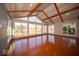 Bright sunroom featuring vaulted ceilings and hardwood floors at 4258 Redman Dr, Greenwood, IN 46142