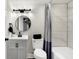 Modern bathroom with a white vanity and black accents at 4360 Guilford Ave, Indianapolis, IN 46205